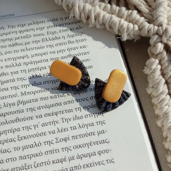 Gold and black glitter triangular stud earrings