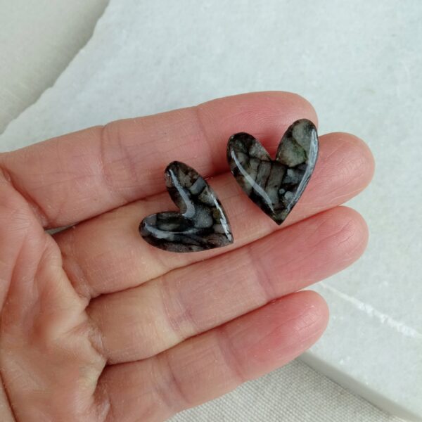 Marbled black and translucent heart studs