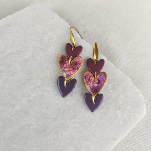 Floral and purple triple heart earrings